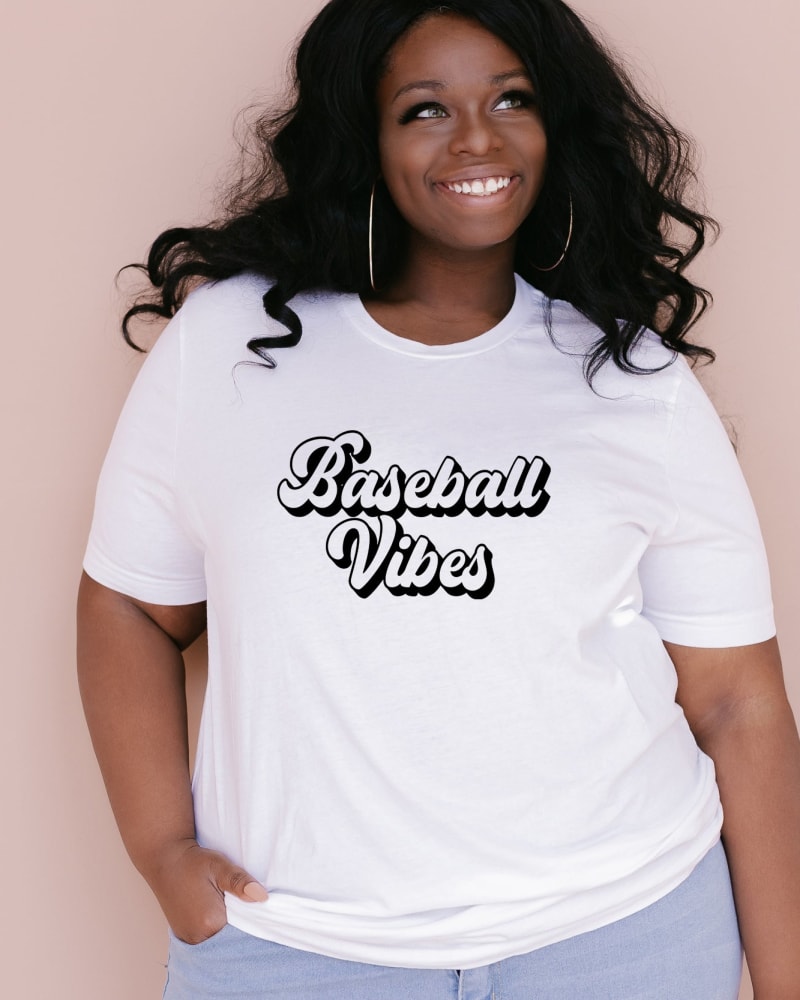 Front of a model wearing a size XL Baseball Vibes Cursive in White by Simply Sage Market. | dia_product_style_image_id:281429
